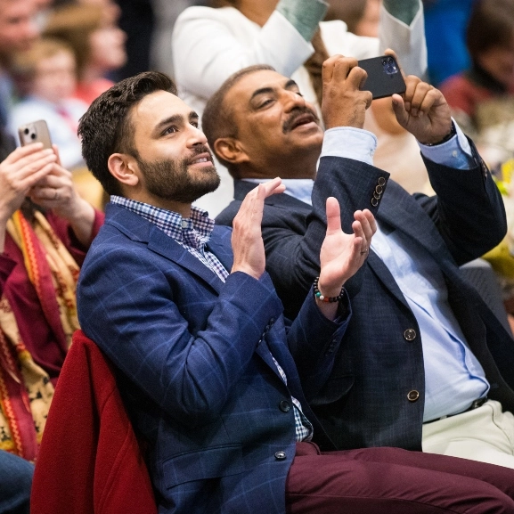 School of Medicine match day attendees smile and cheer for their student who matched to a residency program.