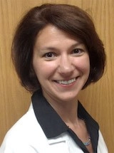 Portrait of Jennifer Myers, M.D. in her physician's coat.