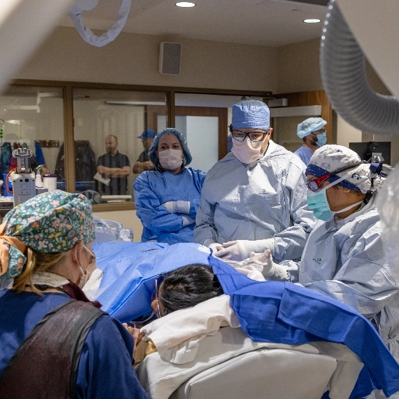 School of Medicine faculty and residents walk down a hallway at one of our affiliate research hospitals.