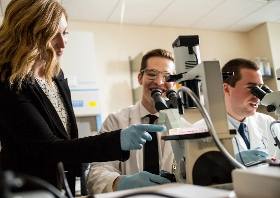 Student researchers working in the lab together.