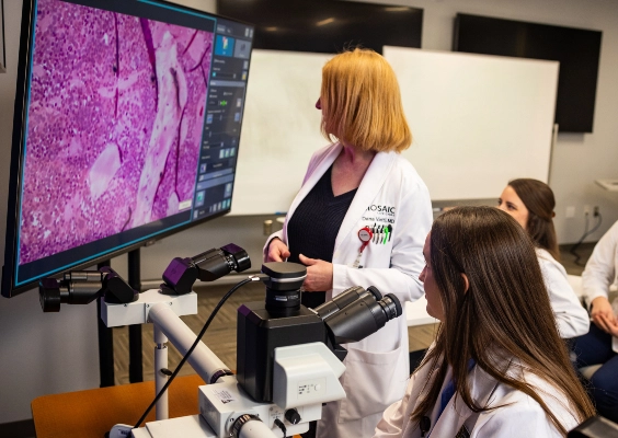 Medical students in the St. Joseph M.D. program participating in a research lab.