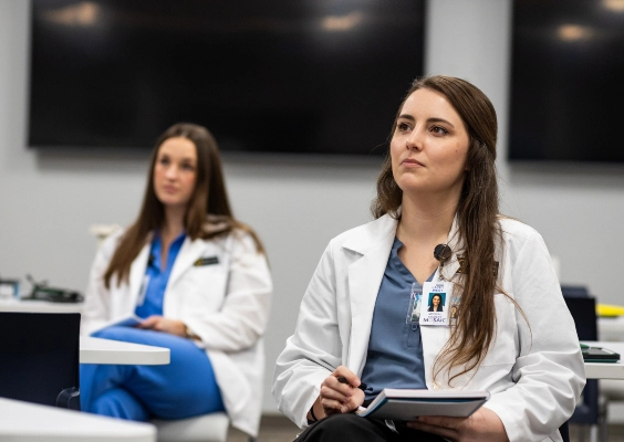 Medicine students looking forward in classroom.